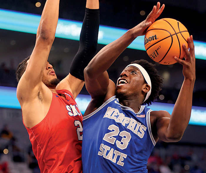 Memphis Tigers forward Malcolm Dandridge shoots the ball over SMU Mustangs forward Isiah Jasey during their AAC Tournament game at Dickies Arena in Fort Worth.